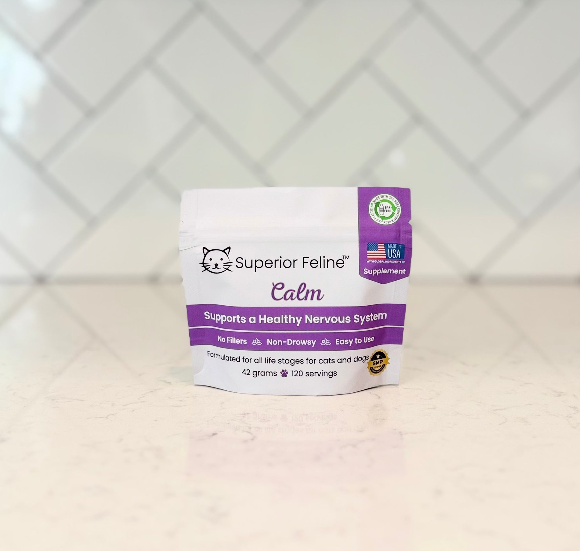 Superior Feline Calm supplement package on a white kitchen countertop surface with a tiled backsplash