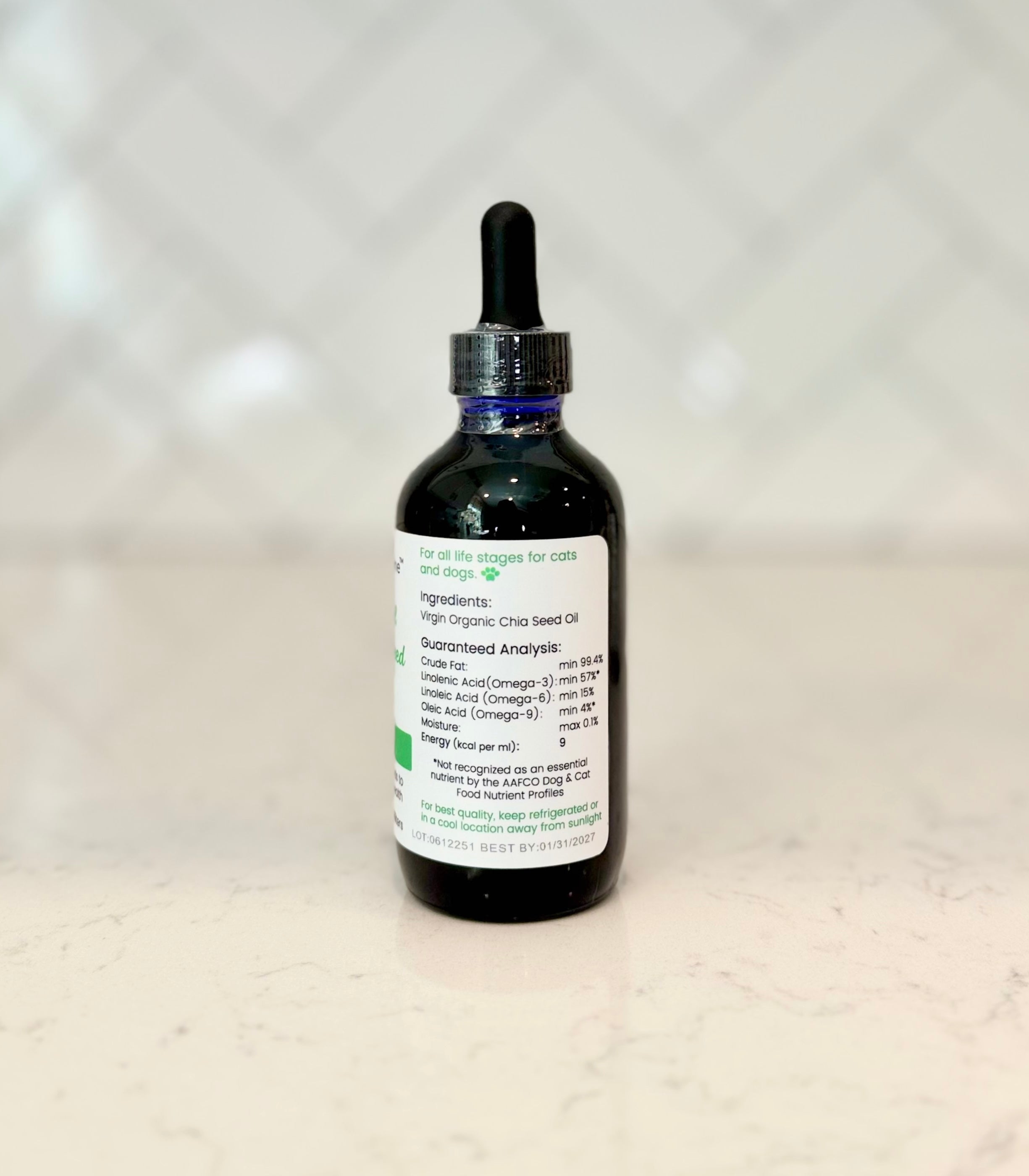 Side view of Superior Feline Chia Seed Oil bottle with label containing info about ingredients and storage