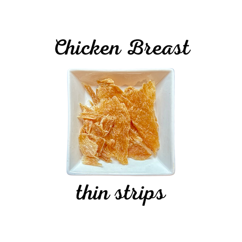 Dried chicken breast thin strips on a white plate with text indicating the product type.