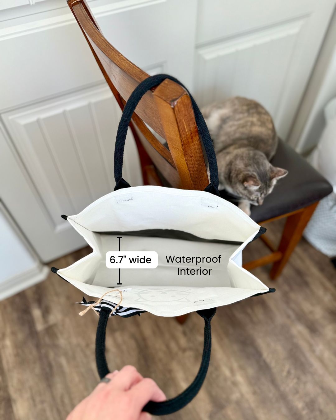 Inside of Superior Feline tote bag showing waterproof interior and 6.7-inch width
