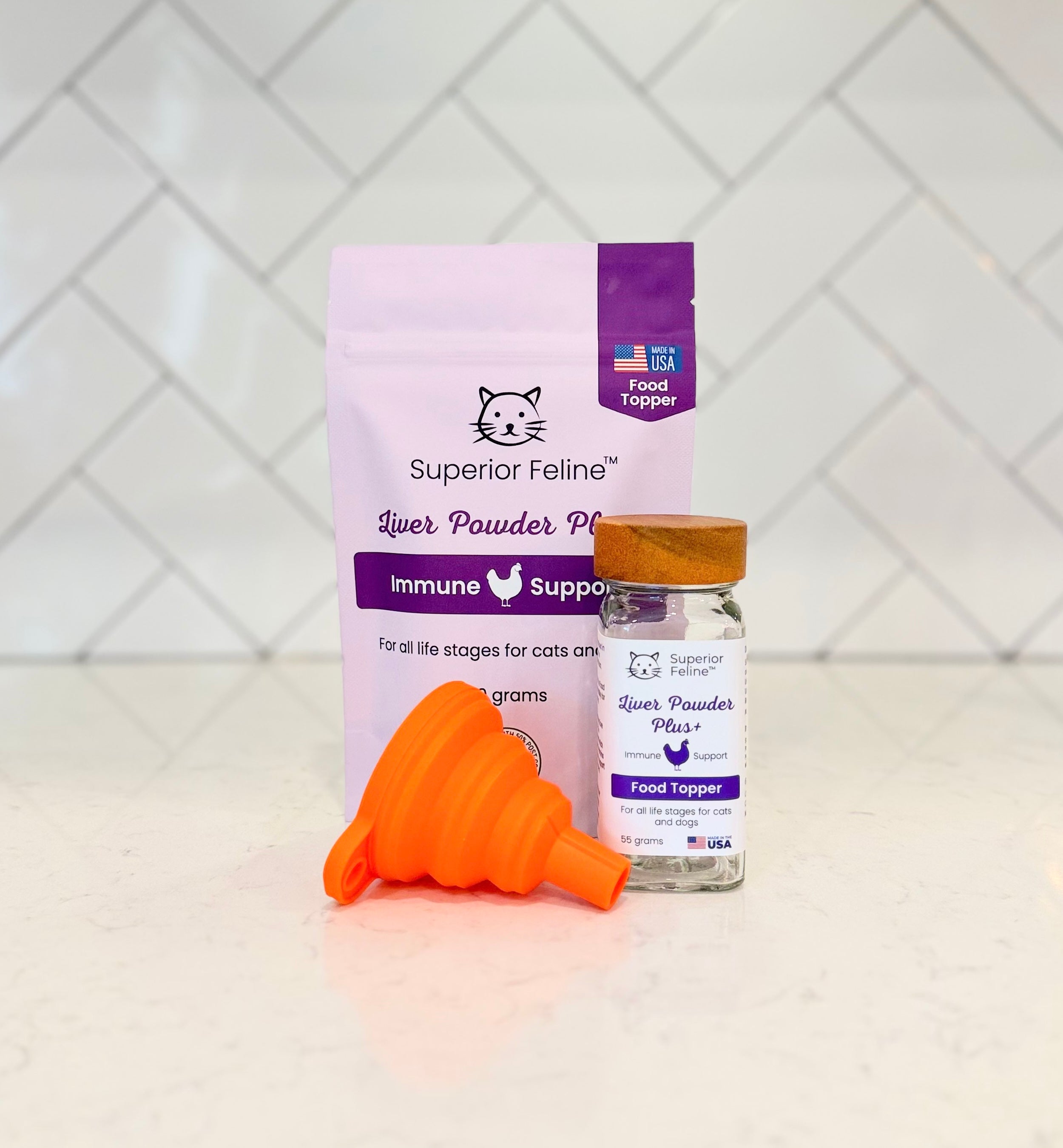 Superior Feline Liver Powder Plus Food Topper Pouch with shaker jar and easy-fill funnel on a tiled background