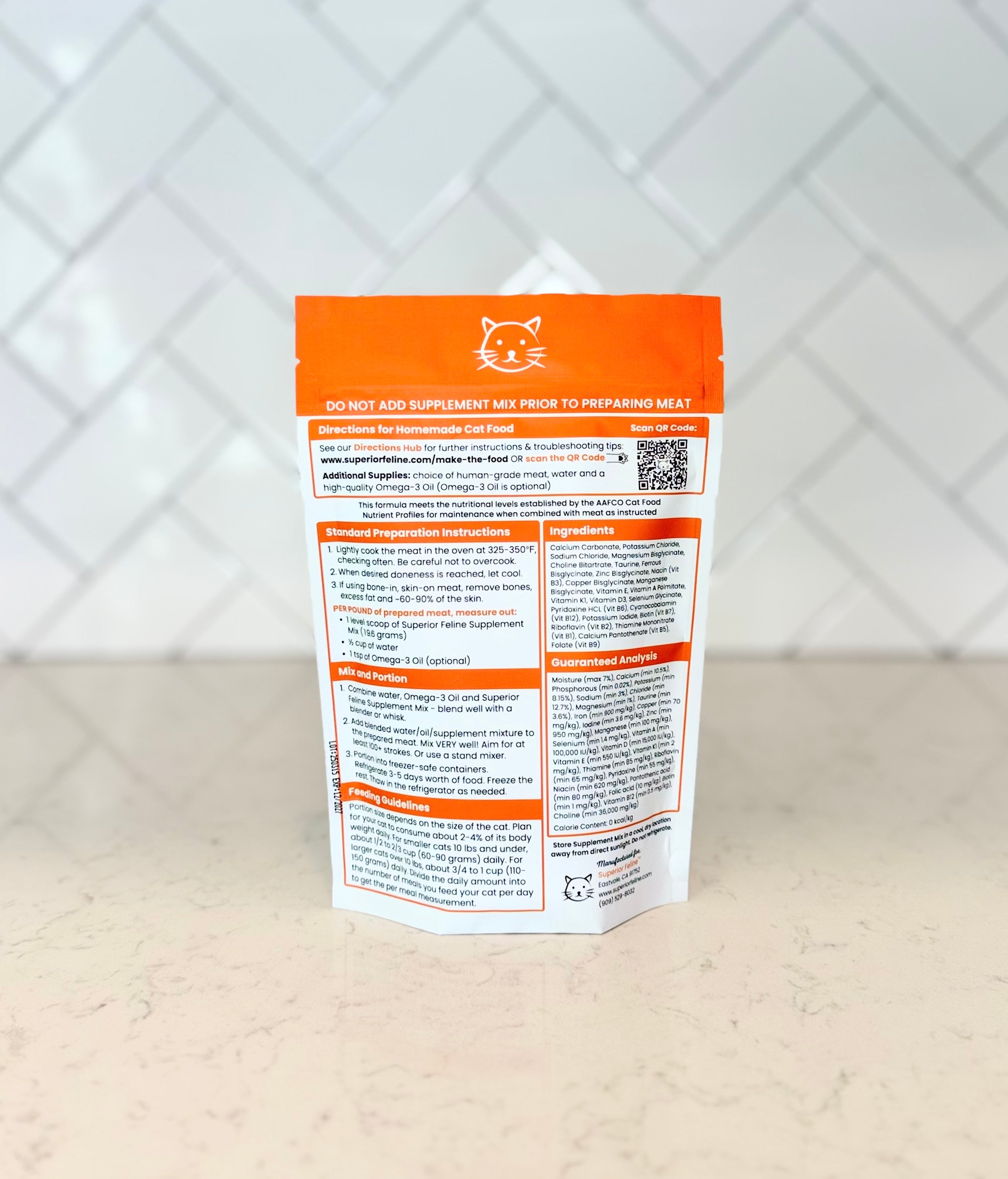 Back view of Superior Feline Homemade Cat Food Supplement Mix with text and a QR code on a white surface.