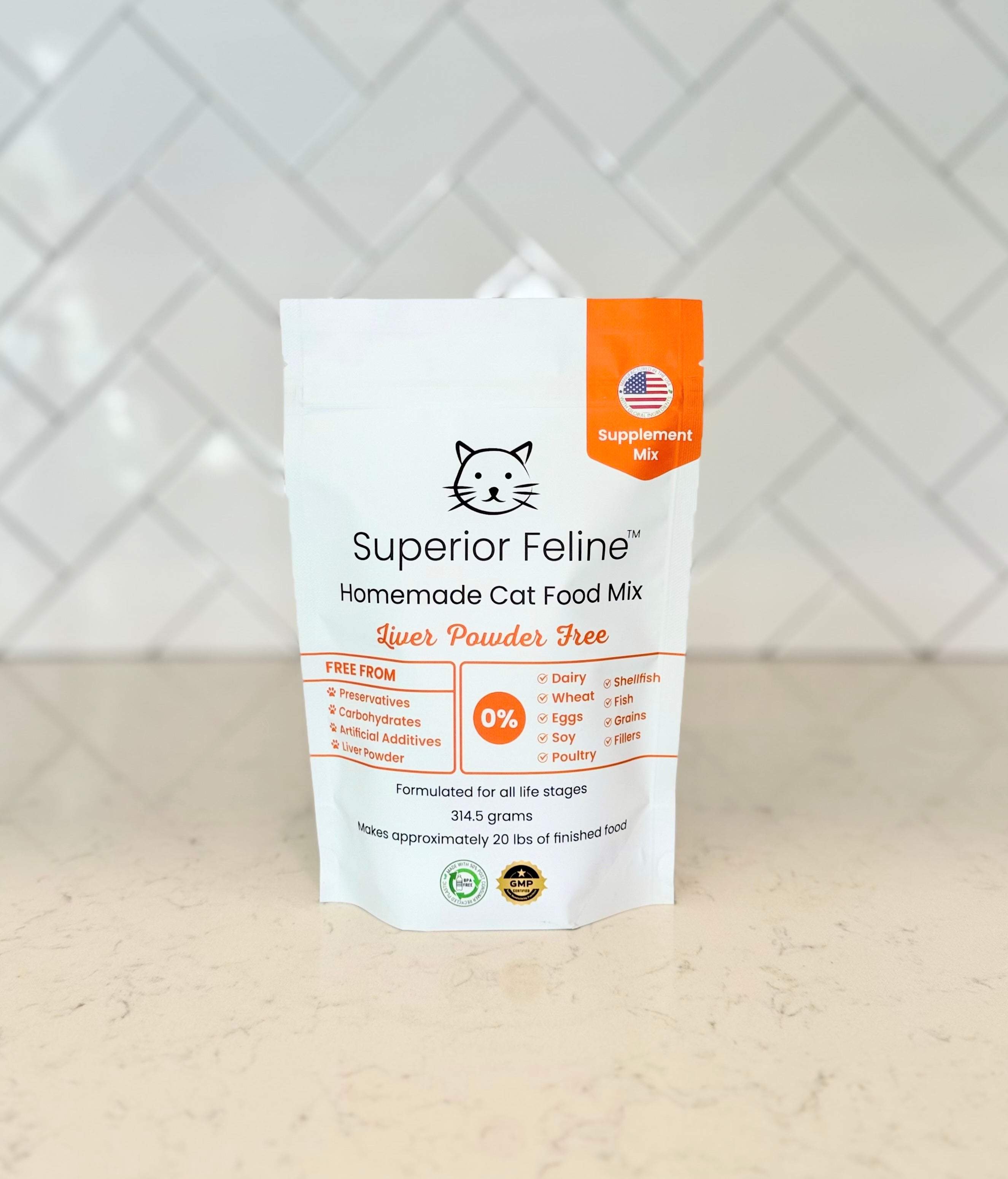 Front view of Superior Feline Liver Powder Free Homemade Cat Food Supplement Mix package on a kitchen countertop with tiled backsplash.