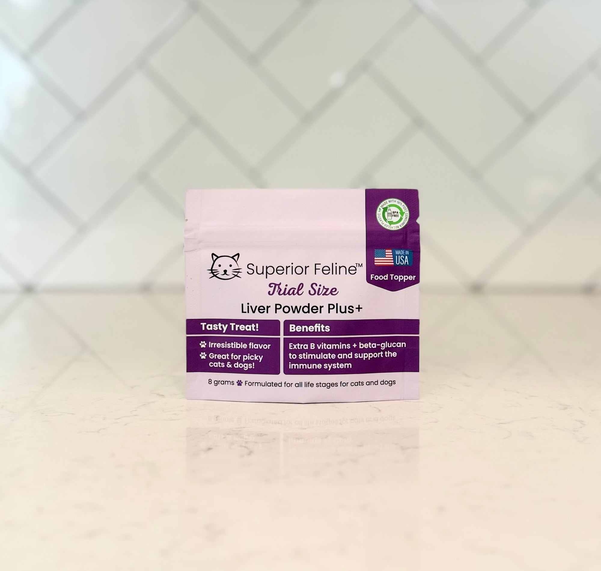 Superior Feline trial size liver powder plus package on a countertop with a tiled backsplash