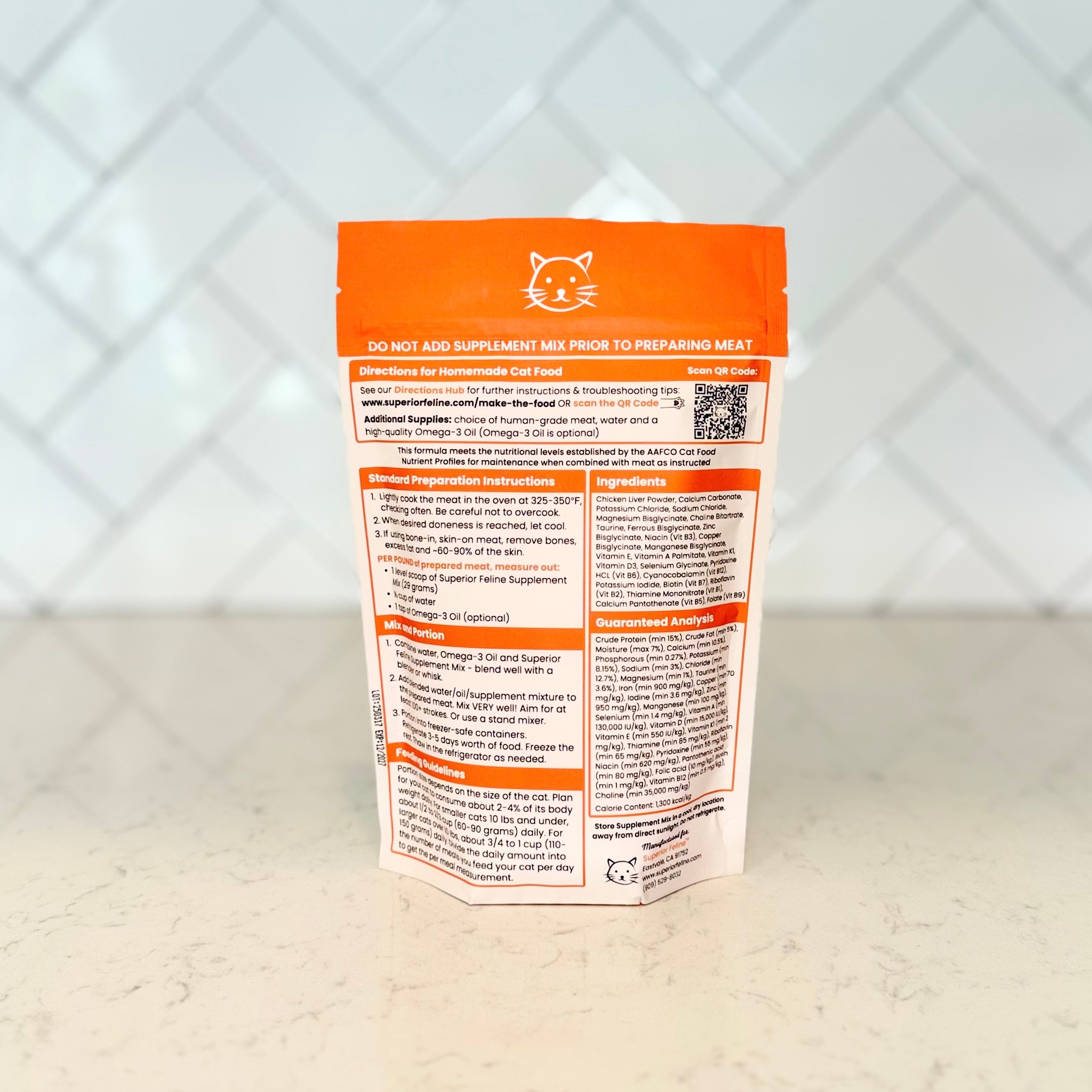 Supplement package with nutritional information on a light surface and tiled wall background