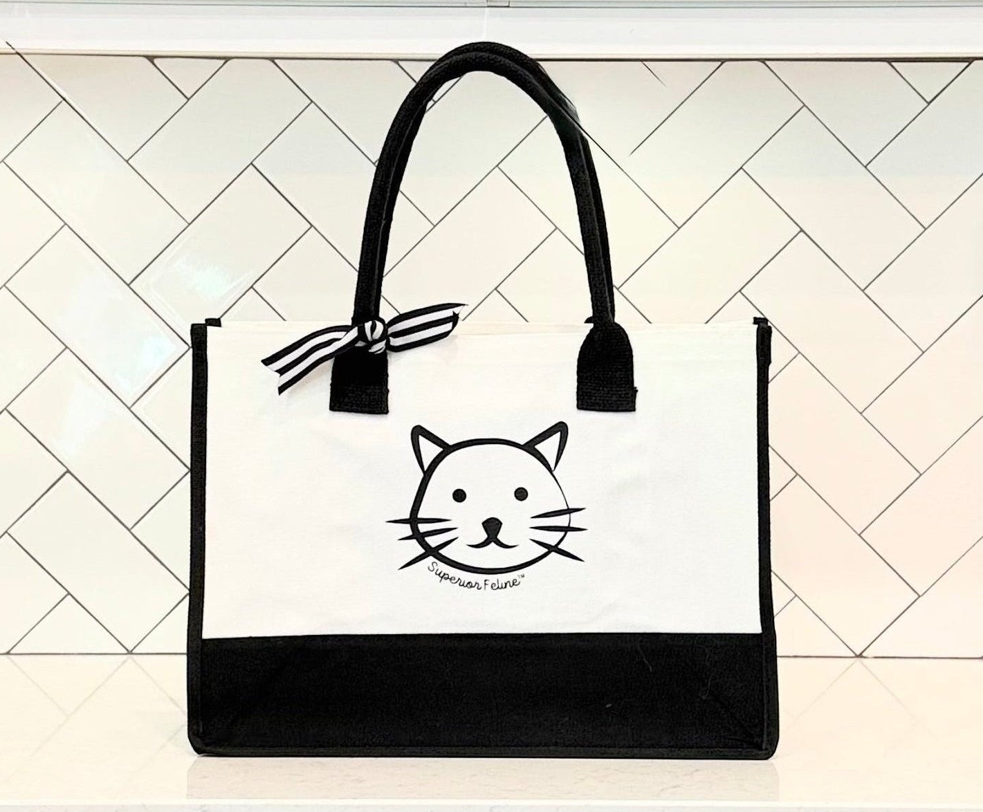Superior Feline branded logo tote on counter top