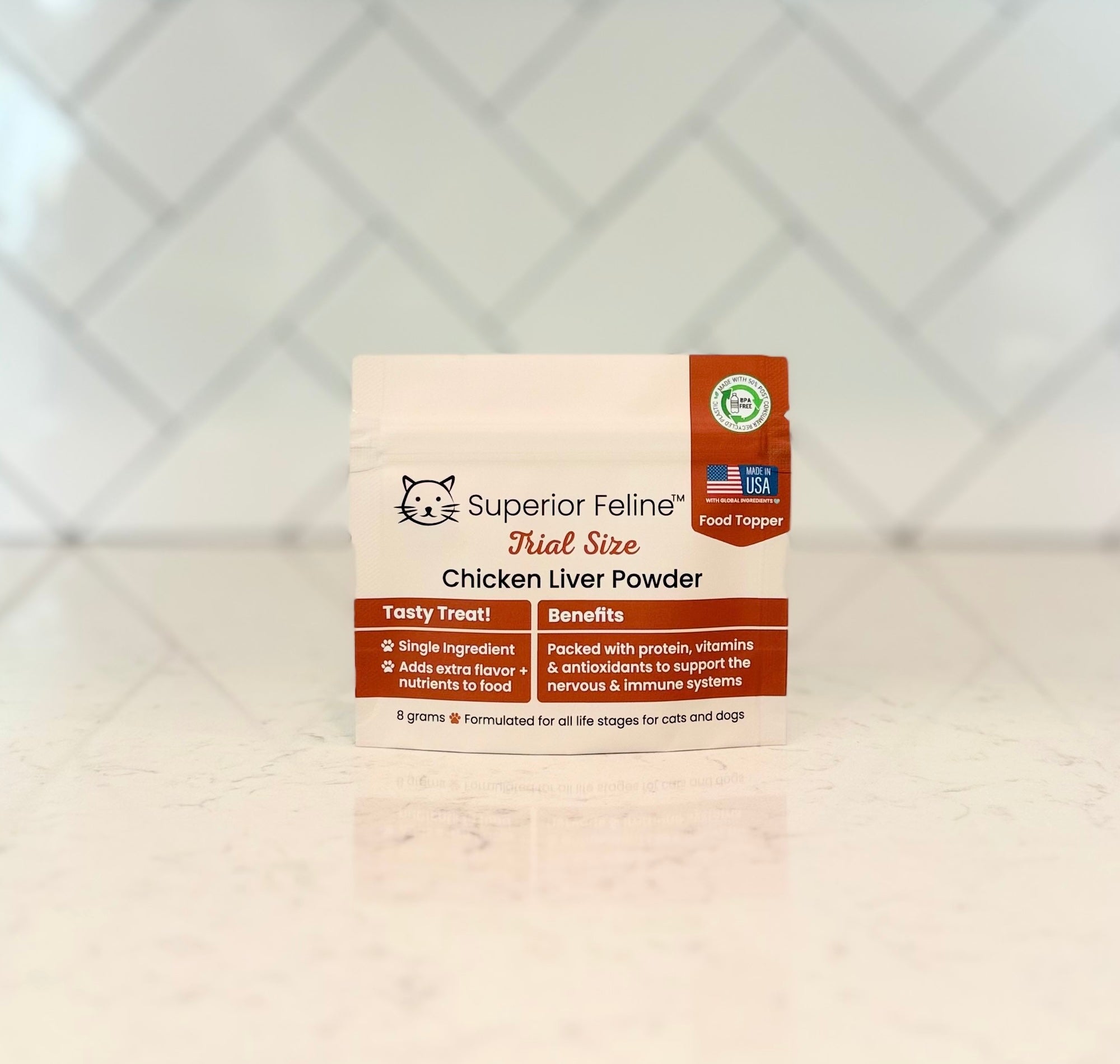 Superior Feline Trial Size Chicken Liver Powder packaging on a light surface with a tiled backsplash