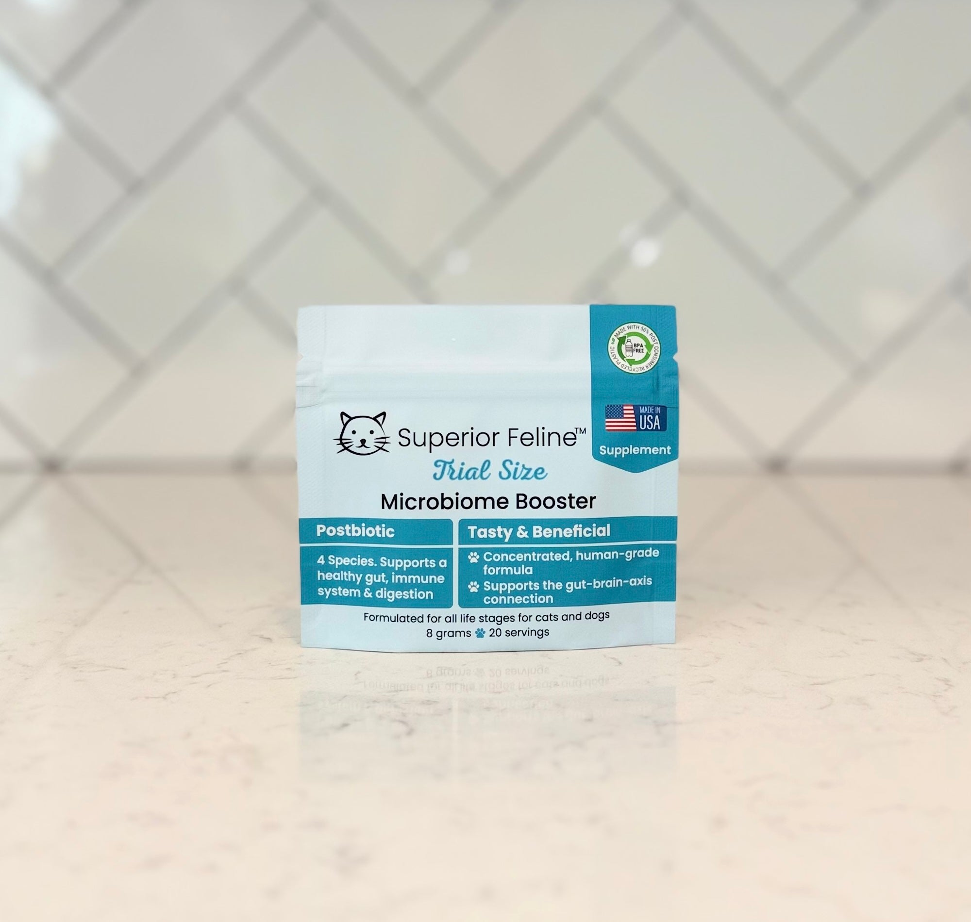 Superior Feline Trial Size Microbiome Booster packaging on a tiled background