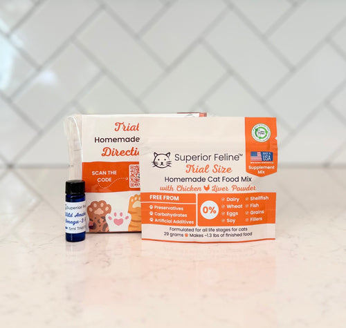 Superior Feline Original Formula Trial Size Kit Supplement Mix and Wild Anchovy Oil on a light surface with a tiled backsplash