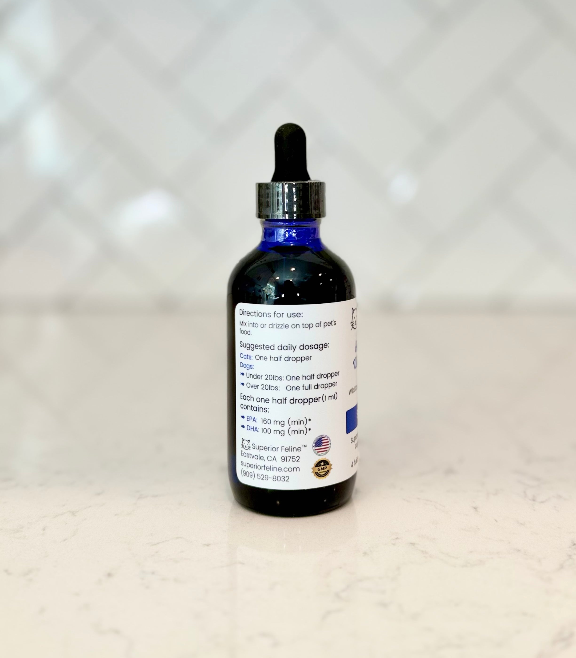 Side View of bottle of Superior Feline Wild Anchovy Oil with text about directions for use